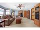 Bright living room featuring neutral walls, plush seating, fireplace, and wood furnishings at 425 Ridgemont Dr, Lawrenceville, GA 30046