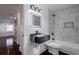 Sleek bathroom features marble tiled shower and floating black vanity sink at 1006 Byron Sw Dr, Atlanta, GA 30310