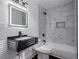 Contemporary bathroom with marble tiled shower and modern black vanity sink at 1006 Byron Sw Dr, Atlanta, GA 30310