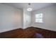 Bedroom with hardwood floors, white trim, and window with natural light at 1006 Byron Sw Dr, Atlanta, GA 30310