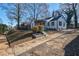 Beautiful renovated two-story home with a cozy front porch, dark trim, and a newly landscaped yard at 1006 Byron Sw Dr, Atlanta, GA 30310