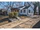 Charming renovated two-story home with a cozy front porch, dark trim, and a newly landscaped yard at 1006 Byron Sw Dr, Atlanta, GA 30310