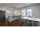 Bright kitchen featuring modern appliances, quartz countertops, and a dining area at 1006 Byron Sw Dr, Atlanta, GA 30310