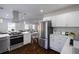 Modern kitchen with stainless steel appliances, white cabinets, and an open layout at 1006 Byron Sw Dr, Atlanta, GA 30310