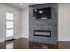 Beautiful living room showcasing a contemporary fireplace, television, and door at 1006 Byron Sw Dr, Atlanta, GA 30310