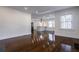 Bright living room with gleaming hardwood floors and an open layout to the modern kitchen at 1006 Byron Sw Dr, Atlanta, GA 30310