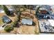 Aerial shot of a cozy home highlighting its yard and proximity to neighboring properties, and local amenities at 122 Goldie Se Dr, Marietta, GA 30067