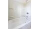 Compact bathroom features a white bathtub and shower combination for a simple and clean design at 122 Goldie Se Dr, Marietta, GA 30067