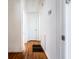 Hallway featuring hardwood floors and white walls at 122 Goldie Se Dr, Marietta, GA 30067