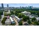 Aerial view showcases property in desirable neighborhood with city skyline in the background at 131 City View Ne Ct, Atlanta, GA 30308