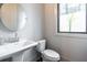 Cozy half bathroom with pedestal sink and classic fixtures at 131 City View Ne Ct, Atlanta, GA 30308