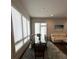 Contemporary dining room with a glass table and large windows providing abundant natural light at 131 City View Ne Ct, Atlanta, GA 30308