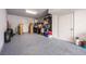 Large garage featuring epoxy floors and ample storage space for vehicles and other items at 131 City View Ne Ct, Atlanta, GA 30308