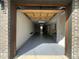 A modern garage shows an epoxied floor and inside entry to the home at 131 City View Ne Ct, Atlanta, GA 30308