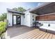 Rooftop deck with wood flooring, a grill, and comfortable seating, perfect for outdoor entertaining at 131 City View Ne Ct, Atlanta, GA 30308