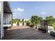 Spacious rooftop deck with wood-look flooring, potted plants, and comfortable outdoor furniture at 131 City View Ne Ct, Atlanta, GA 30308