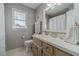 Bathroom featuring a large mirror, neutral cabinets, and a shower with curtain at 1953 Graystone Pkwy, Grayson, GA 30017