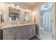 Bathroom featuring a double vanity, marble countertop, updated fixtures, and a shower at 1953 Graystone Pkwy, Grayson, GA 30017