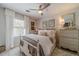 Bright bedroom with a large window, comfortable bedding, and neutral color scheme at 1953 Graystone Pkwy, Grayson, GA 30017