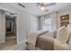 Bedroom featuring a comfortable bed, neutral walls, and view into the ensuite at 1953 Graystone Pkwy, Grayson, GA 30017