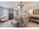 Relaxing primary bedroom featuring soft colors, natural light, and stylish furniture at 1953 Graystone Pkwy, Grayson, GA 30017