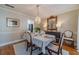 Elegant dining room with a chandelier, hardwood floors, and neutral decor, perfect for formal gatherings at 1953 Graystone Pkwy, Grayson, GA 30017