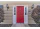 Inviting red front door with sidelights, decorative hardware, and house number 1953 at 1953 Graystone Pkwy, Grayson, GA 30017