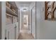 Hallway featuring built-in storage and access to other rooms in the home at 1953 Graystone Pkwy, Grayson, GA 30017