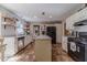 Spacious kitchen with white cabinets, modern appliances, subway tile backsplash, and a functional center island at 1953 Graystone Pkwy, Grayson, GA 30017