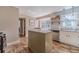 Bright kitchen featuring a center island, white cabinets, stainless steel appliances, and subway tile backsplash at 1953 Graystone Pkwy, Grayson, GA 30017