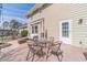 Outdoor patio offers a comfortable seating area with umbrella and dining table for al fresco enjoyment at 1953 Graystone Pkwy, Grayson, GA 30017