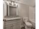 Bathroom with a granite vanity, modern lighting, toilet, and bathtub at 203 Daisy Ne Ct, Cartersville, GA 30121