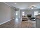 Bright and airy living room with a fireplace, hardwood floors, and a neutral color palette at 203 Daisy Ne Ct, Cartersville, GA 30121