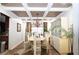 Stylish dining room with decorative coffered ceiling, chandelier, and large window offering ample natural light at 402 Rising Cir, Woodstock, GA 30189