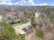 High-angle image of the property, capturing the home's design and neighborhood landscape, ideal for privacy at 5020 Puritan Dr, Sugar Hill, GA 30518