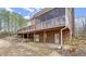 View of the home's backyard patio and screened in porch, offering an ideal space for outdoor relaxation at 5020 Puritan Dr, Sugar Hill, GA 30518