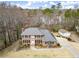 A charming two-story home with black shutters, a brick facade, and a well-manicured lawn at 5020 Puritan Dr, Sugar Hill, GA 30518