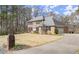 Beautiful two-story home boasting a brick facade, black shutters, and well-maintained landscaping at 5020 Puritan Dr, Sugar Hill, GA 30518