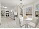 Modern kitchen and breakfast area features stainless appliances, white cabinetry and lots of natural light at 5020 Puritan Dr, Sugar Hill, GA 30518