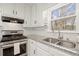 Stylish kitchen details stainless steel appliances, granite countertops, and white subway tile backsplash at 5020 Puritan Dr, Sugar Hill, GA 30518