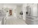 Well-lit kitchen with stainless steel refrigerator, ample cabinetry, and a breakfast nook at 5020 Puritan Dr, Sugar Hill, GA 30518