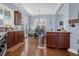 Open kitchen and dining area featuring granite counters, stainless appliances, and hardwood floors at 9204 Malcolm Dr, Covington, GA 30014