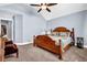 Spacious main bedroom with vaulted ceiling, ceiling fan and nice furniture at 9204 Malcolm Dr, Covington, GA 30014