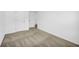 Spacious bedroom featuring neutral carpet flooring, white walls and trim, and ample natural light at 11961 Lovejoy Crossing Way, Hampton, GA 30228