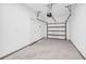 Spacious garage with clean floor, door to the house, and an automatic door opener at 11961 Lovejoy Crossing Way, Hampton, GA 30228
