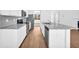 Bright kitchen with granite countertops, stainless steel appliances, and a stylish center island at 11961 Lovejoy Crossing Way, Hampton, GA 30228
