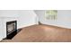 Bright living space with a modern fireplace and wood flooring at 11961 Lovejoy Crossing Way, Hampton, GA 30228