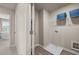 Functional laundry room with overhead shelving, utility sink, and connections for appliances at 1217 Arnhem Dr, Hampton, GA 30228