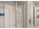 Modern shower with glass doors, white tile, and convenient access to the bathroom at 1217 Arnhem Dr, Hampton, GA 30228