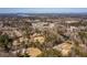 High aerial view showcasing a neighborhood near a lake surrounded by dense trees, offering scenic views at 1537 David Lee St, Acworth, GA 30102